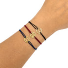 Stoffarmbänder mit Sternzeichen Symbolen goldfarben